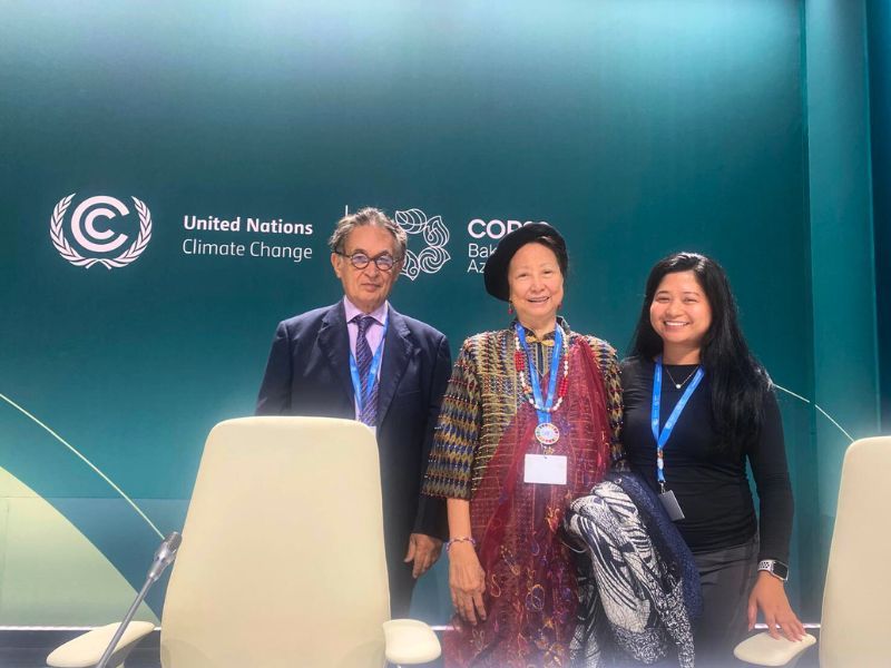 Viktor Sebek, Cecile Alvarez, and Dewy Sacayan posing together at the SSCC press conference during COP29. They stand in front of a backdrop displaying the United Nations Climate Change and COP29 Baku Azerbaijan logos, marking the conclusion of their work at the event.