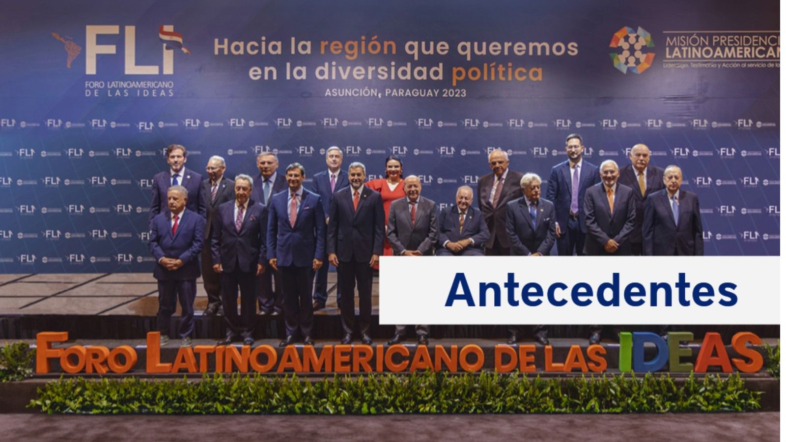 A group of distinguished Latin American leaders, including former presidents, pose for an official photograph at the Forum of Ideas in Asunción, Paraguay. The backdrop displays the event's slogan: "Hacia la región que queremos en la diversidad política," reflecting the forum's mission to foster unity and progress in the region. The stage is decorated with vibrant lettering that reads "Foro Latinoamericano de las Ideas.